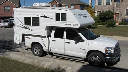 Truck with truck bed camper