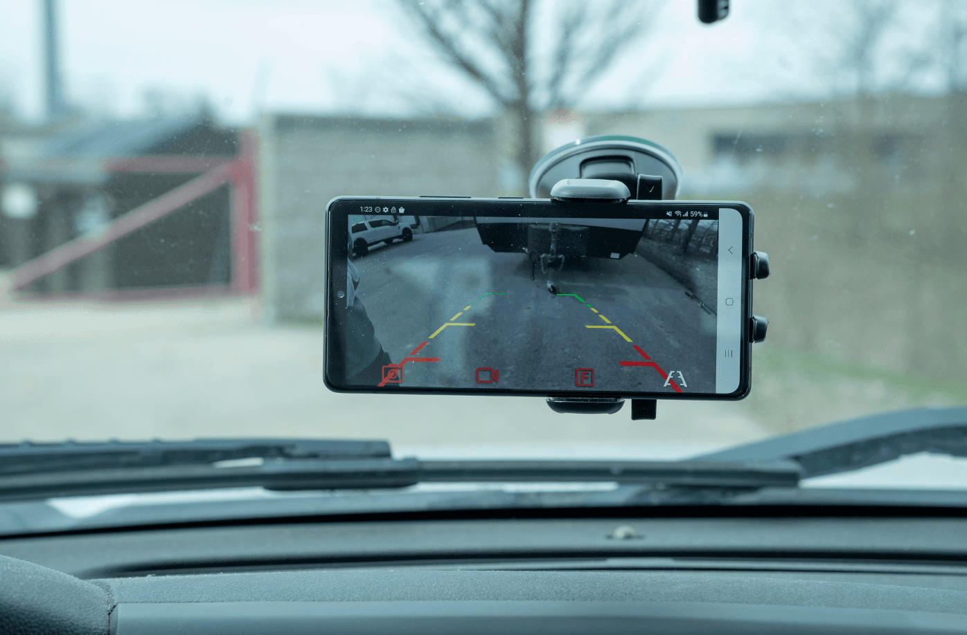 Mounted phone displaying Towtal View backup feed